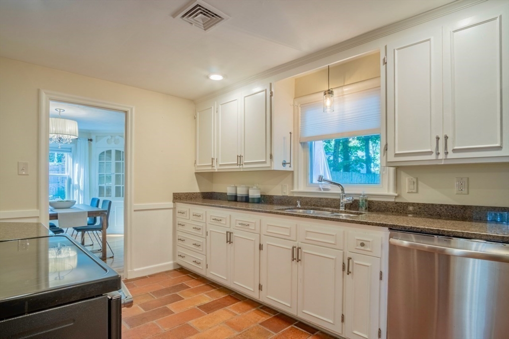 3 Elliot Road Lynnfield, MA 01940 - Photo 13 of 42 a kitchen with granite countertop white cabinets and a sink