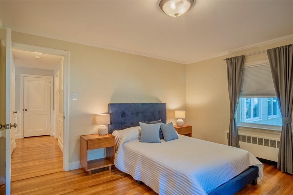 3 Elliot Road Lynnfield, MA 01940 - Photo 20 of 42 a bedroom with a bed and wooden floor