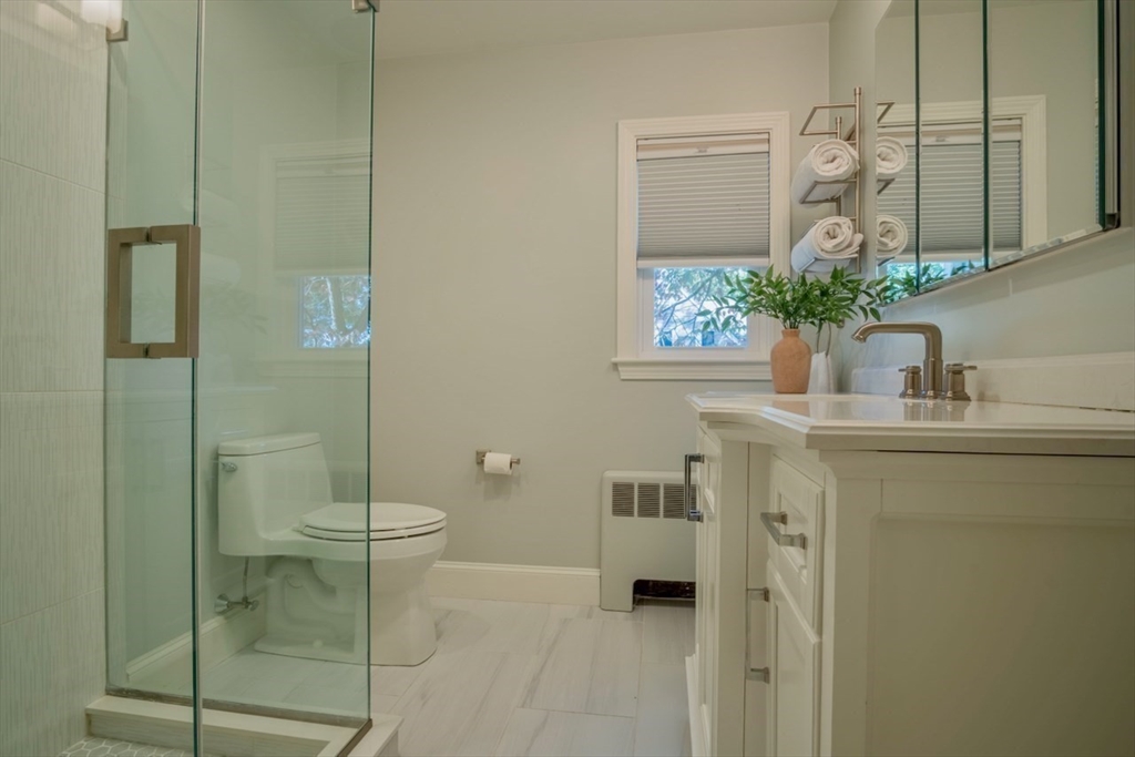 3 Elliot Road Lynnfield, MA 01940 - Photo 21 of 42 a bathroom with a toilet sink and shower