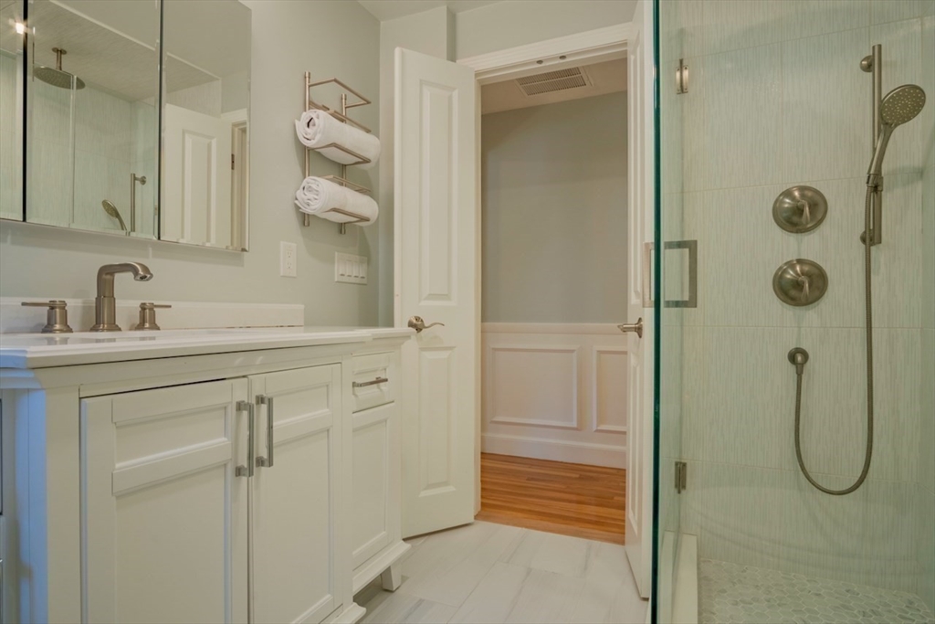 3 Elliot Road Lynnfield, MA 01940 - Photo 22 of 42 a bathroom with a shower sink and mirror