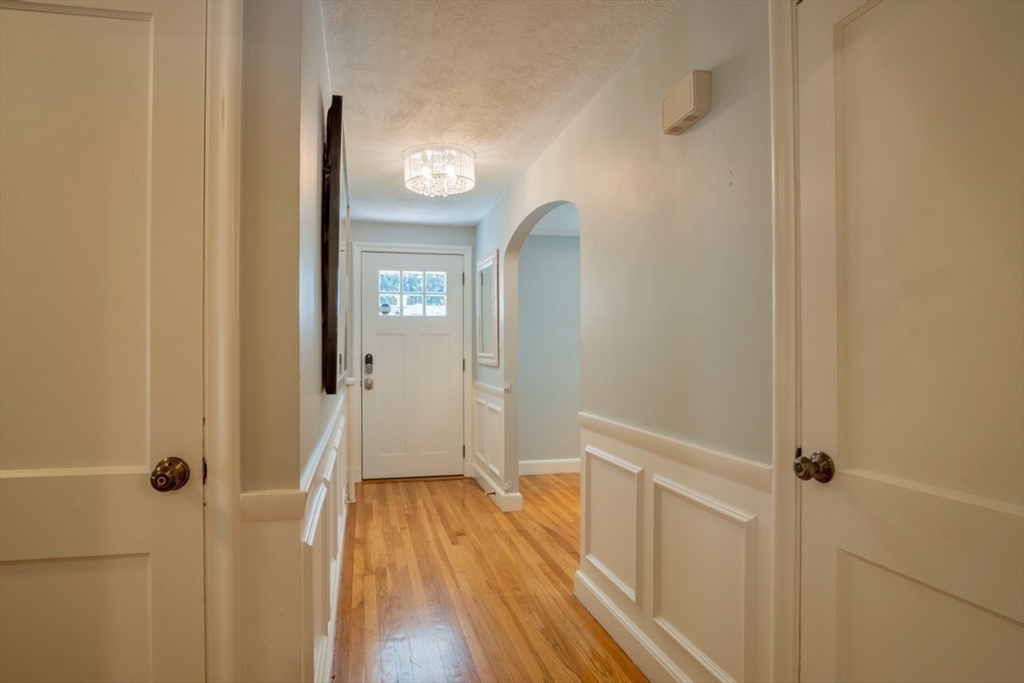 3 Elliot Road Lynnfield, MA 01940 - Photo 24 of 42 a view of a hallway with wooden floor