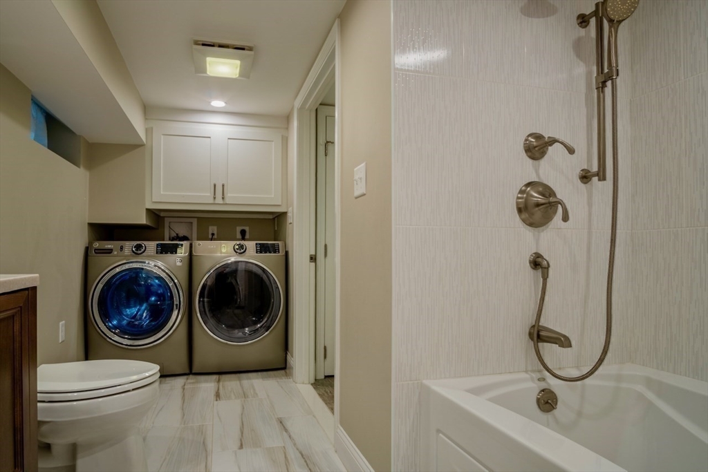 3 Elliot Road Lynnfield, MA 01940 - Photo 35 of 42 a bathroom with a sink a toilet and shower