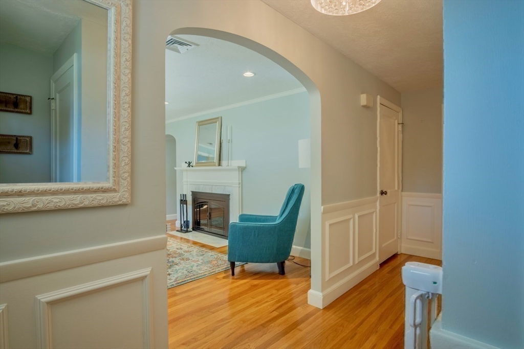 3 Elliot Road Lynnfield, MA 01940 - Photo 5 of 42 a view of a livingroom with furniture and a mirror