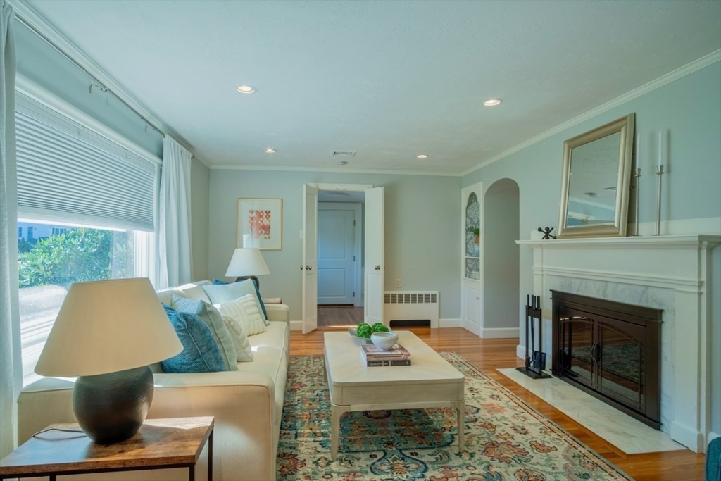 3 Elliot Road Lynnfield, MA 01940 - Photo 6 of 42 a living room with furniture and a fireplace