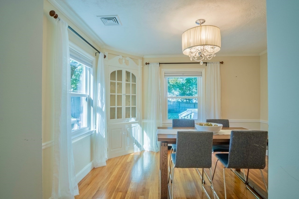3 Elliot Road Lynnfield, MA 01940 - Photo 10 of 42 a view of a dining room with furniture wooden floor and chandelier