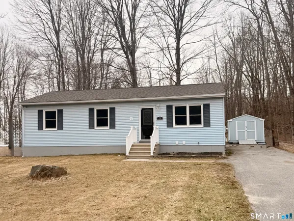 a house with yard in front of it