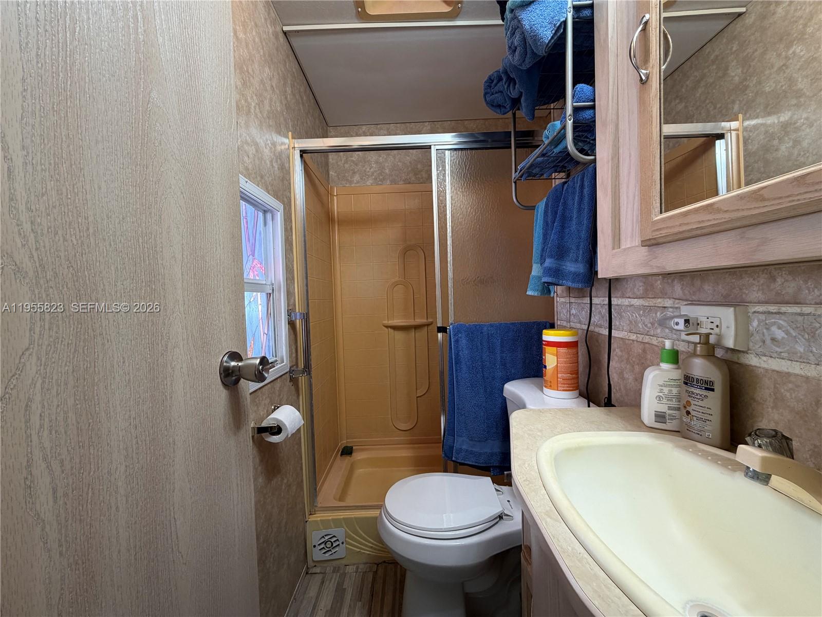 1361 Overseas Highway Marathon, FL 33050 - Photo 3 of 12 a bathroom with a sink a toilet and shower