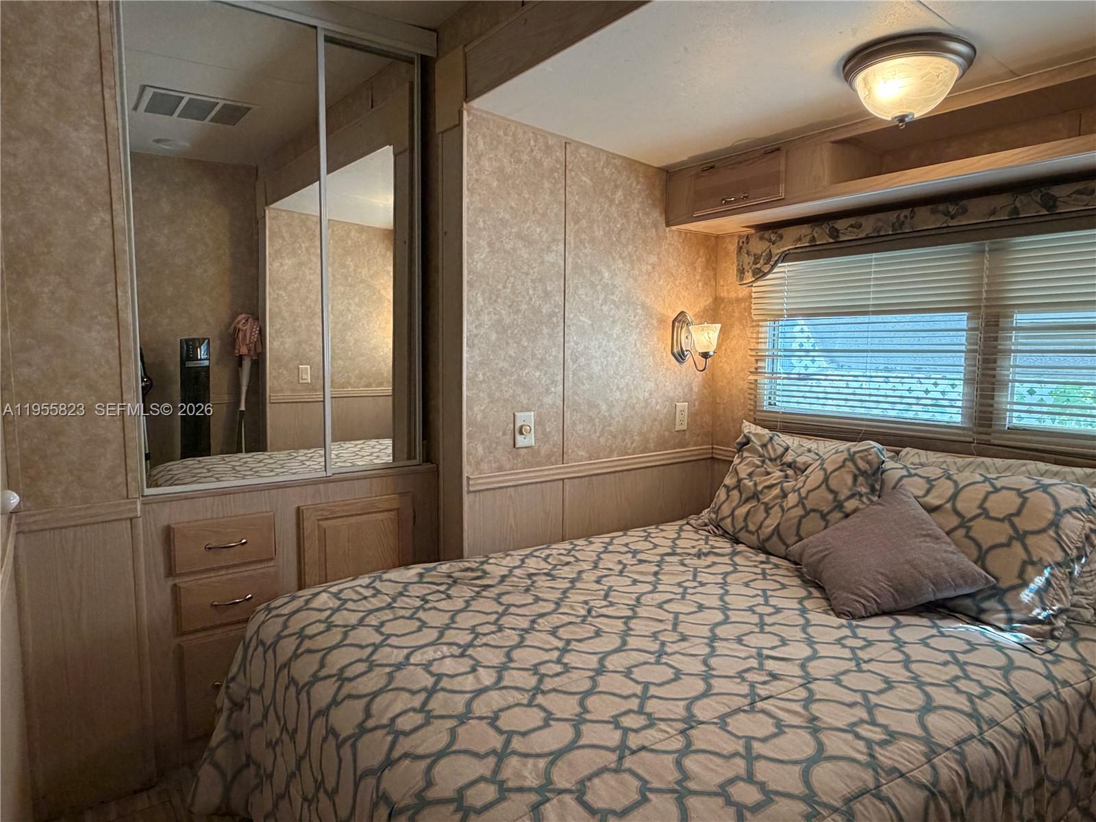 1361 Overseas Highway Marathon, FL 33050 - Photo 4 of 12 a bedroom with a large bed and a window