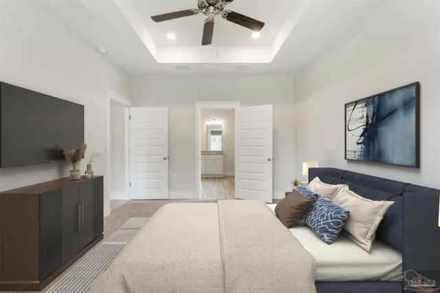 a bedroom with a bed and a flat screen tv