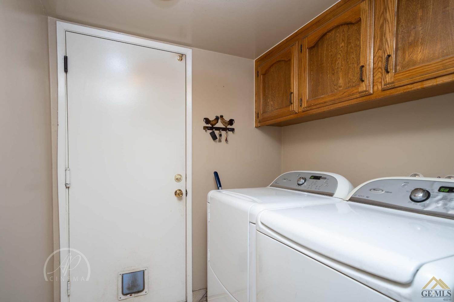 Undisclosed Address Bakersfield, CA 93309 - Photo 13 of 26 a utility room with dryer and washer