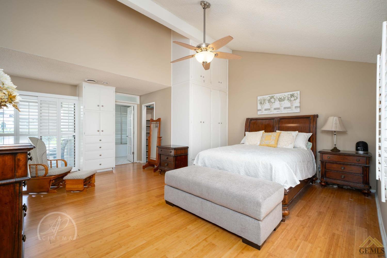 Undisclosed Address Bakersfield, CA 93309 - Photo 14 of 26 a bedroom with a bed and wooden floor
