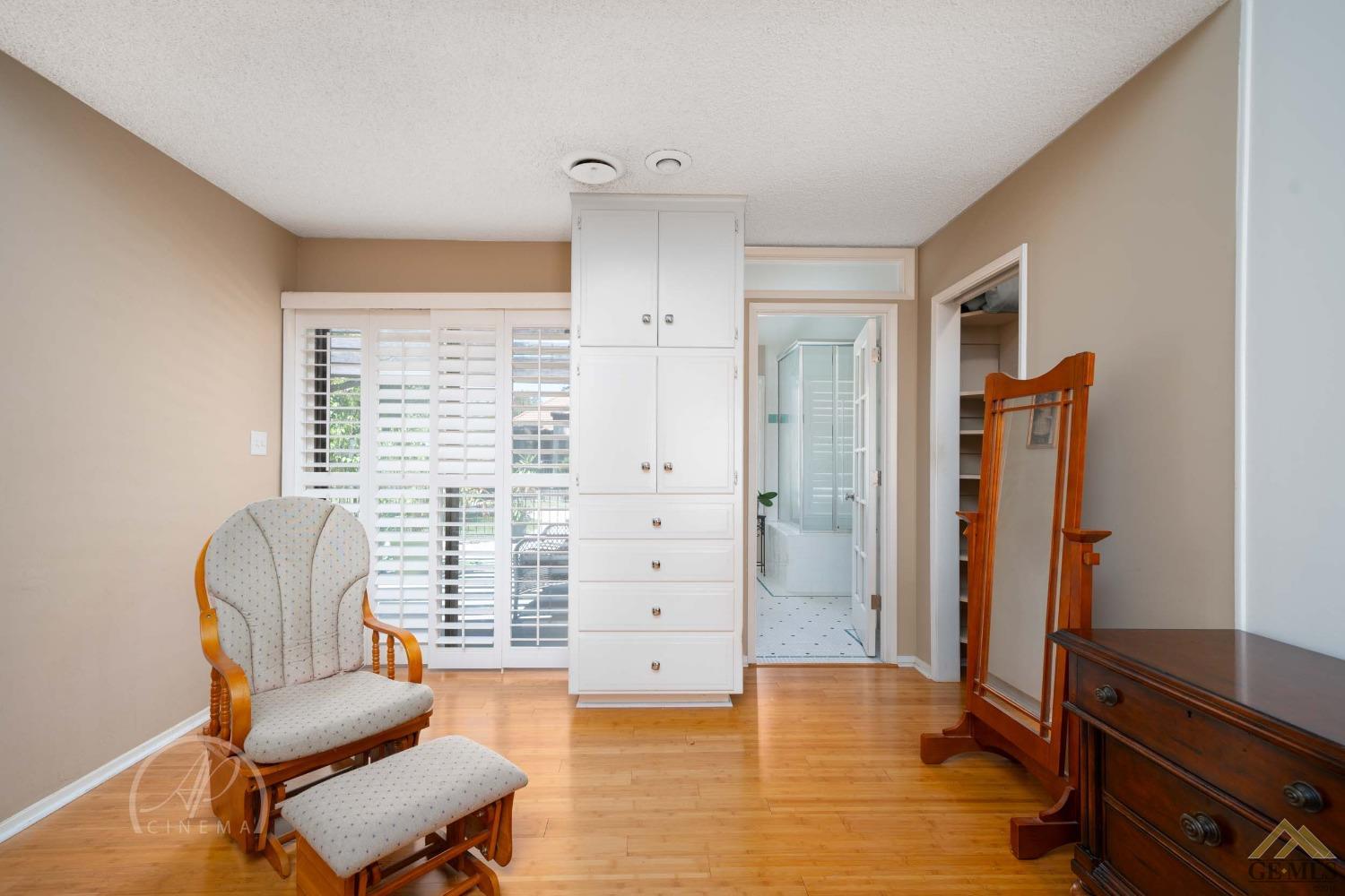 Undisclosed Address Bakersfield, CA 93309 - Photo 15 of 26 a living room with furniture and a wooden floor