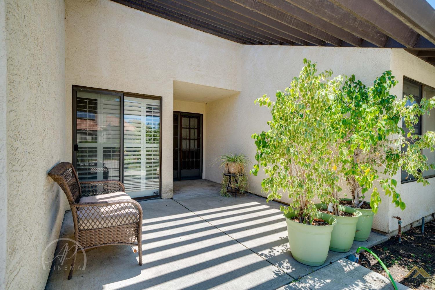 Undisclosed Address Bakersfield, CA 93309 - Photo 22 of 26 a balcony with furniture and a potted plant