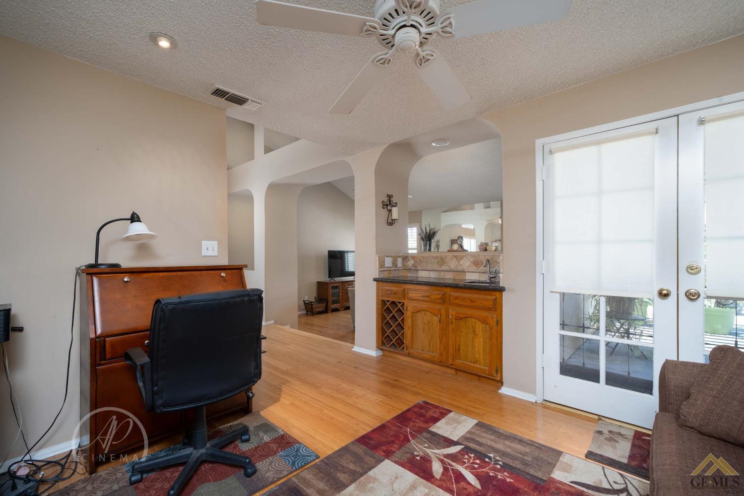 Undisclosed Address Bakersfield, CA 93309 - Photo 3 of 26 a living room with furniture and wooden floor