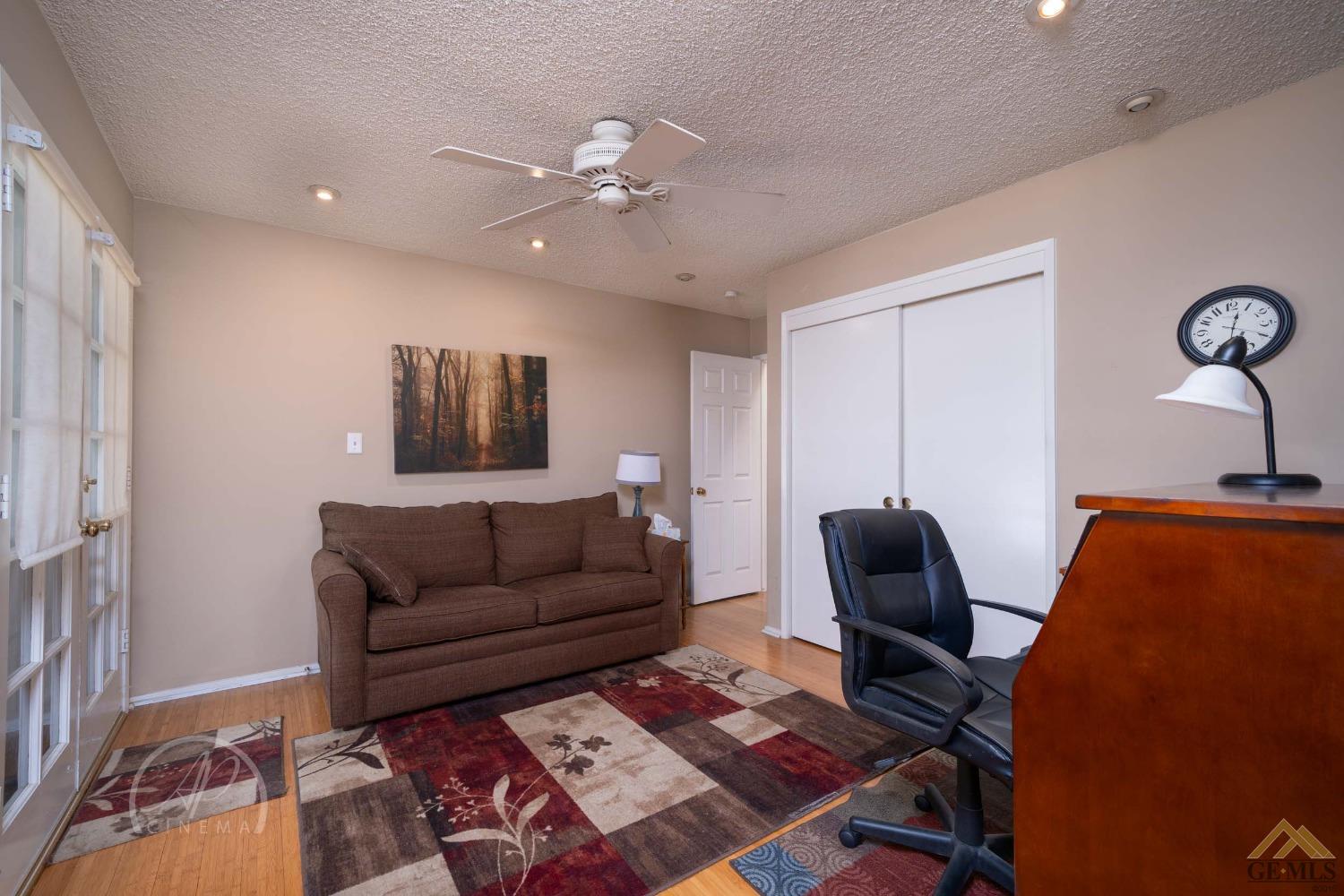 Undisclosed Address Bakersfield, CA 93309 - Photo 5 of 26 a living room with furniture and a rug