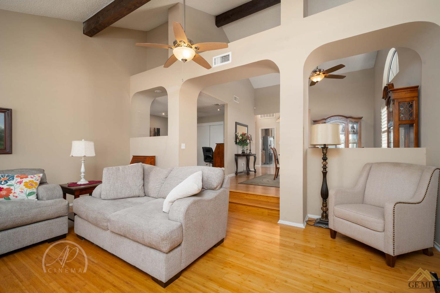 Undisclosed Address Bakersfield, CA 93309 - Photo 7 of 26 a living room with furniture and wooden floor
