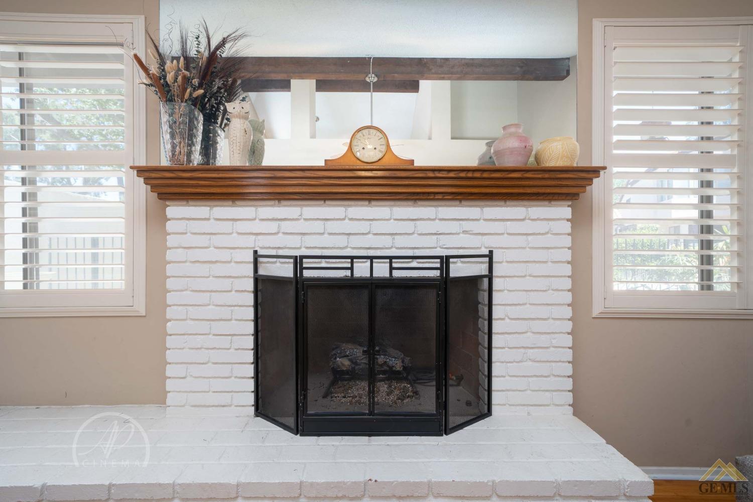 Undisclosed Address Bakersfield, CA 93309 - Photo 8 of 26 a close view of a fireplace with wooden floor