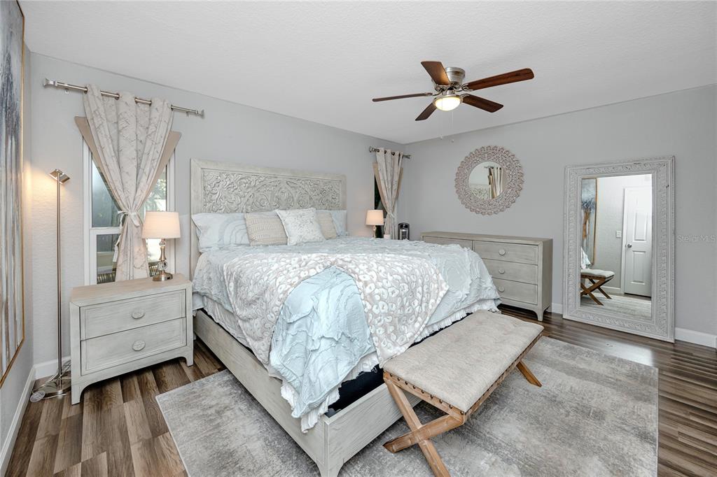 1869 Seton Drive Clearwater, FL 33763 - Photo 12 of 40 a bedroom with a bed mirror and a window