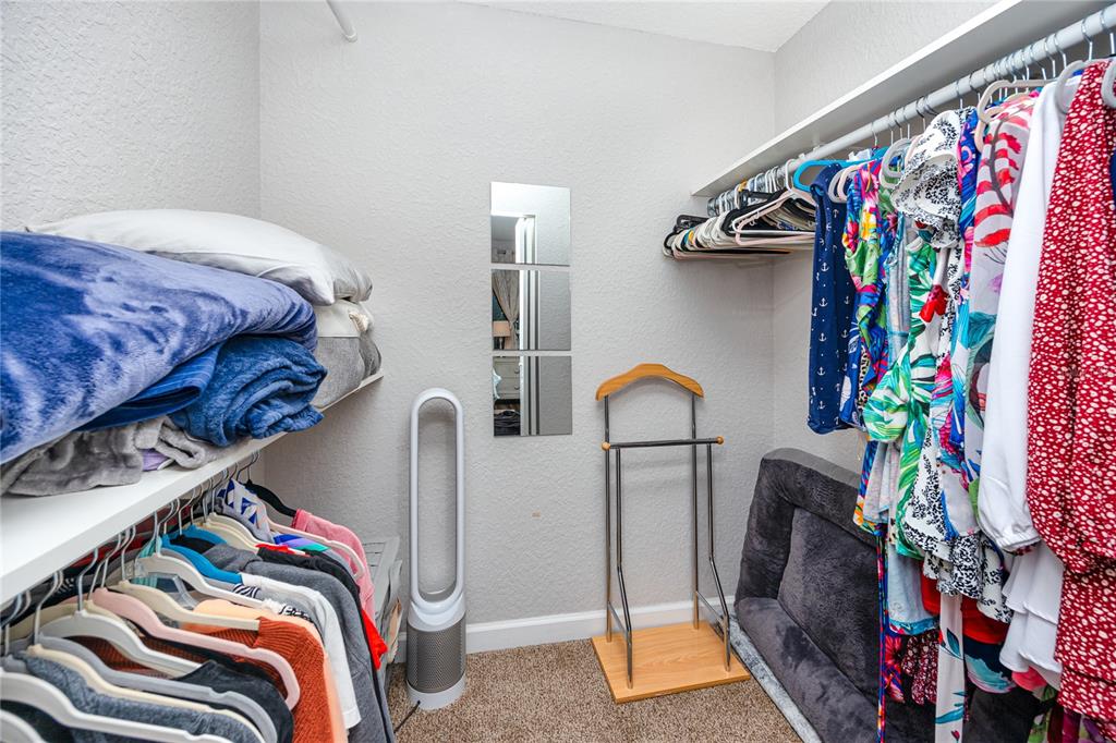 1869 Seton Drive Clearwater, FL 33763 - Photo 16 of 40 a bedroom with bed and a walk in closet