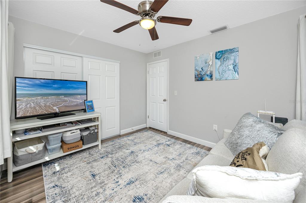 1869 Seton Drive Clearwater, FL 33763 - Photo 18 of 40 a living room with furniture and a flat screen tv