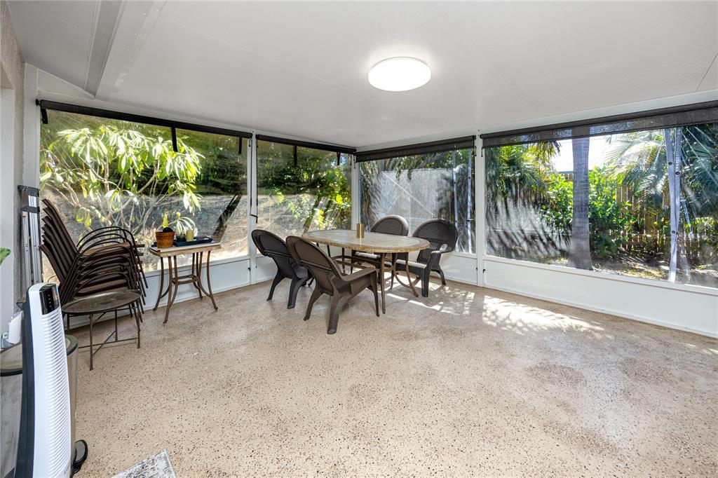 1869 Seton Drive Clearwater, FL 33763 - Photo 25 of 40 a view of a big room with furniture and floor to ceiling window