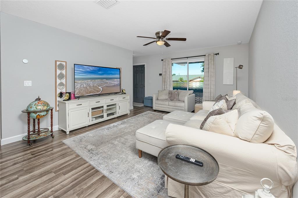 1869 Seton Drive Clearwater, FL 33763 - Photo 3 of 40 a living room with furniture and a flat screen tv