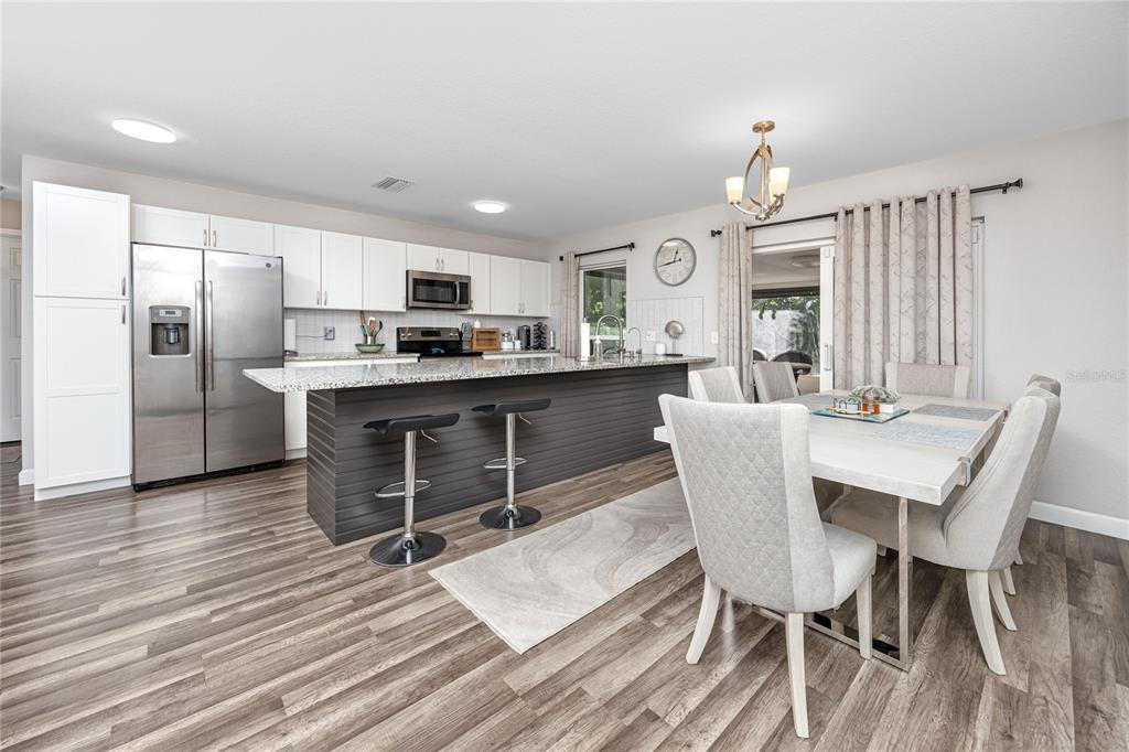 1869 Seton Drive Clearwater, FL 33763 - Photo 6 of 40 a view of a dining room with furniture window and wooden floor