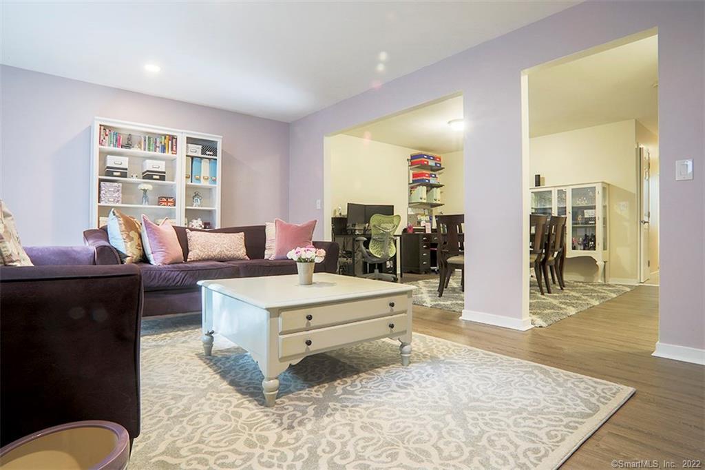300 Flax Hill Road, Unit 26 Norwalk, CT 06854 - Photo 1 of 1 a living room with furniture and a flat screen tv