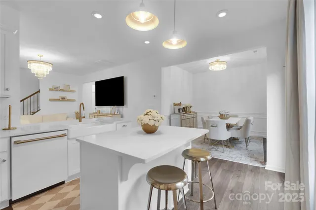 a kitchen with a sink and a stove top oven