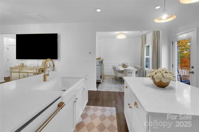 a kitchen with a sink and a stove top oven
