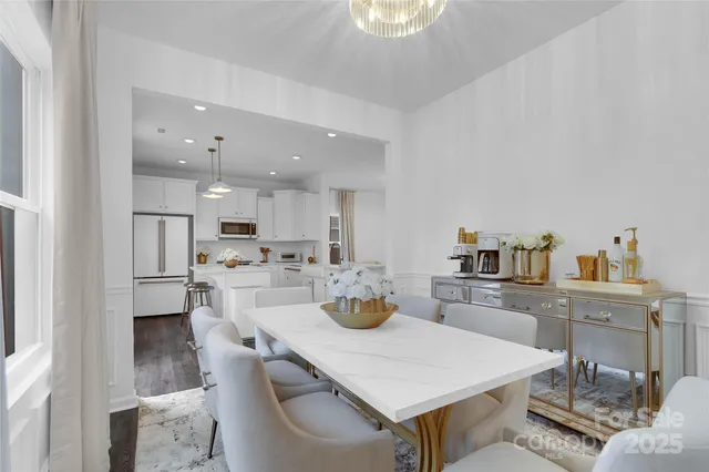 a kitchen with a dining table and chairs