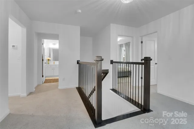 a view of a hallway view with staircase