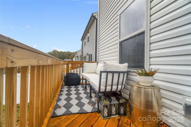 a view of balcony with furniture