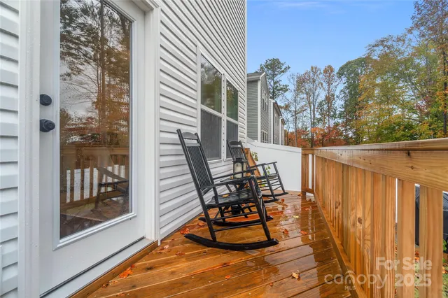 a view of a balcony with chairs