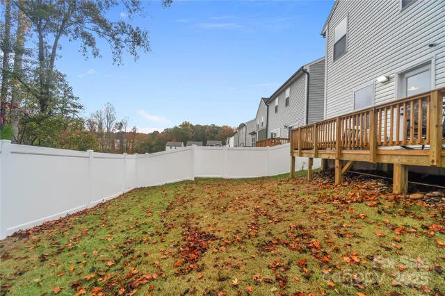 a balcony with table and chairs