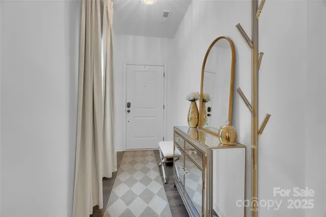 a view of an entryway with wooden floor