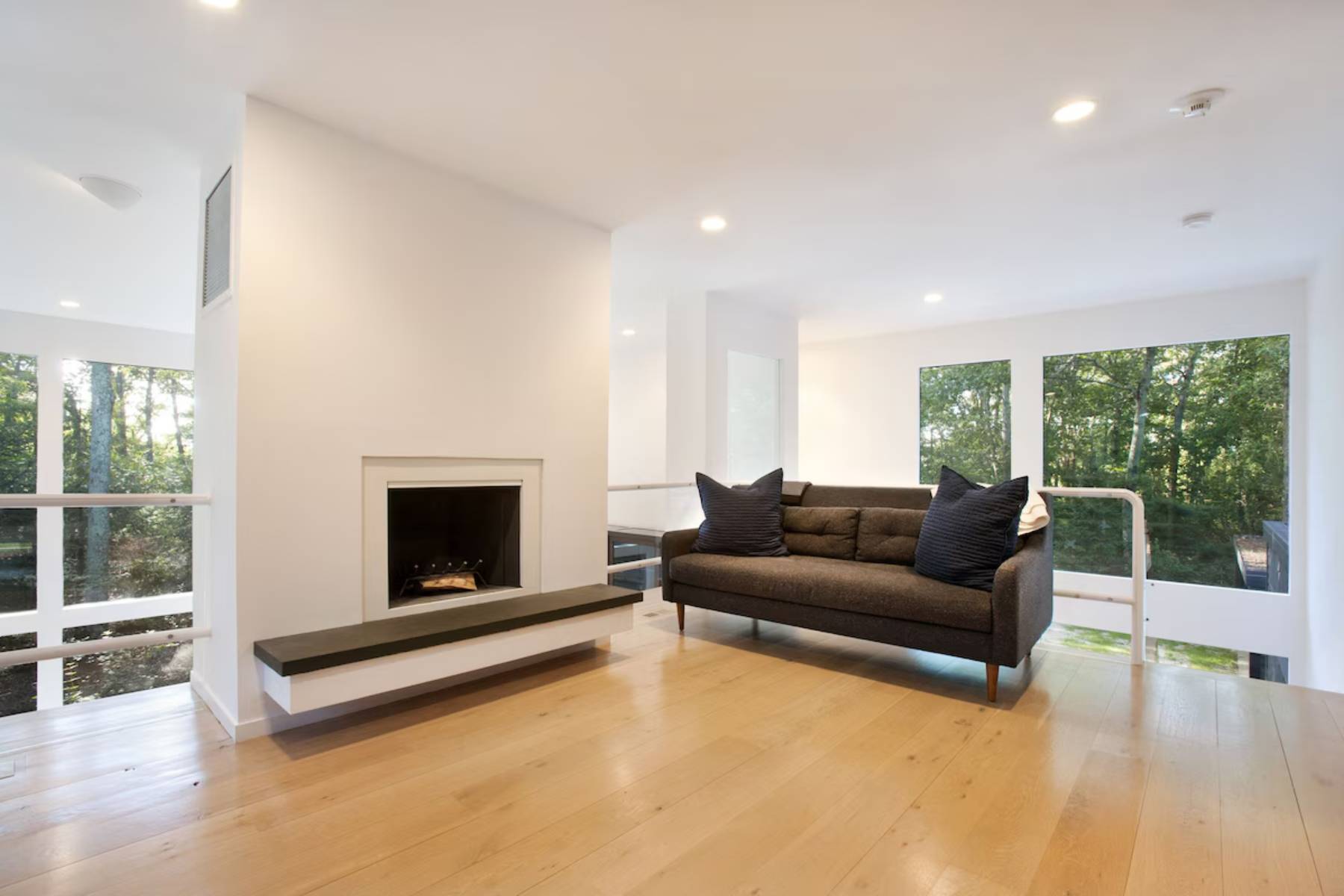 1006 Head Of Pond Road Water Mill, NY 11976 - Photo 11 of 18 a living room with furniture and a fireplace