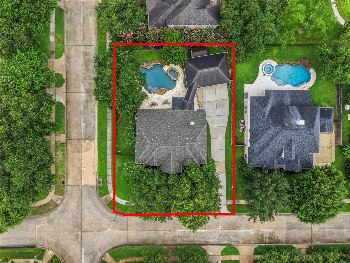 2876 Match Point Lane Friendswood, TX 77546 - Photo 2 of 45 Situated on a large, lush corner lot