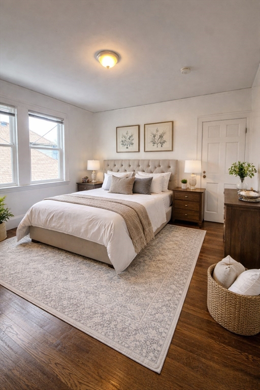 a spacious bedroom with a bed and furniture