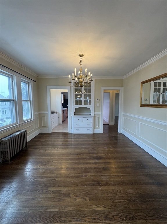 127 St Andrew Road, Unit 2 Boston, MA 02128 - Photo 12 of 15 an empty room with wooden floor and windows