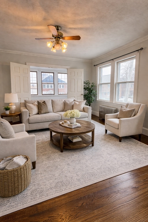 127 St Andrew Road, Unit 2 Boston, MA 02128 - Photo 4 of 15 a living room with furniture and a large window