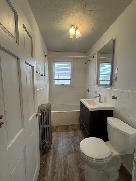 127 St Andrew Road, Unit 2 Boston, MA 02128 - Photo 7 of 15 a bathroom with a toilet a sink and mirror