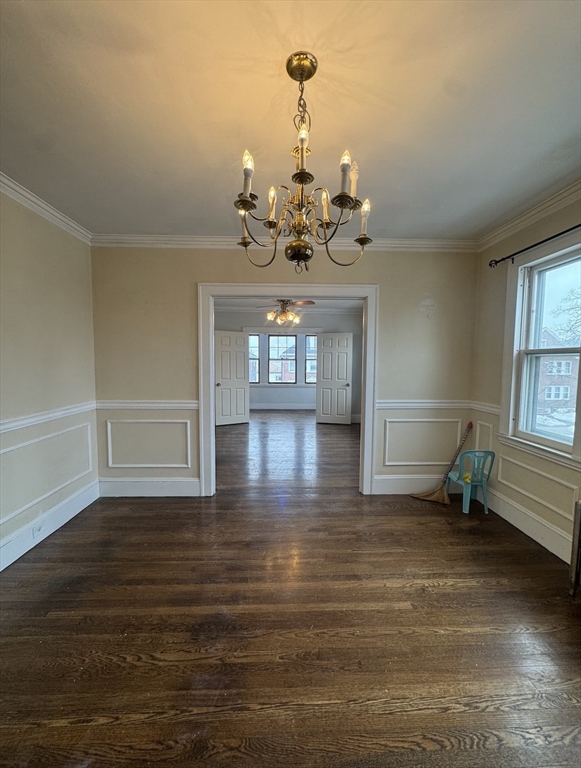 127 St Andrew Road, Unit 2 Boston, MA 02128 - Photo 8 of 15 a view of a room with wooden floor chandelier and windows