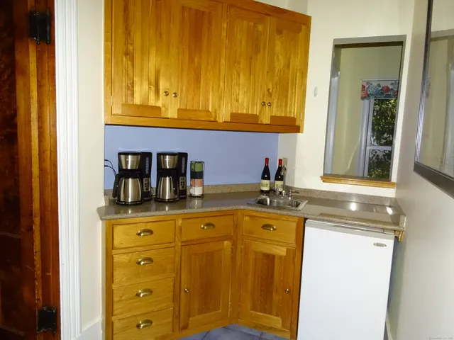 a kitchen with a refrigerator sink and stove