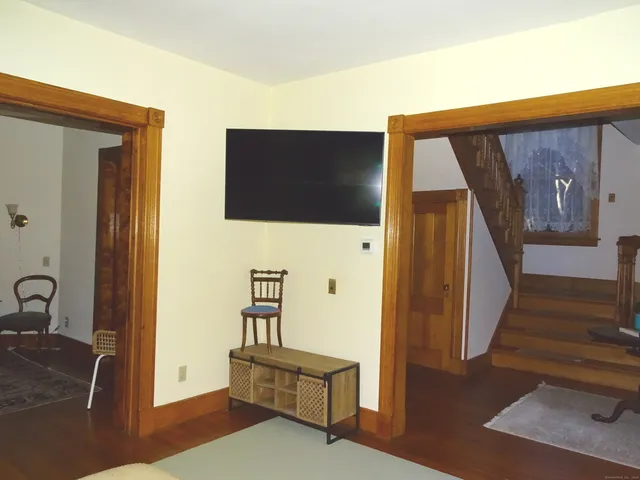 a living room with a rug and a rug