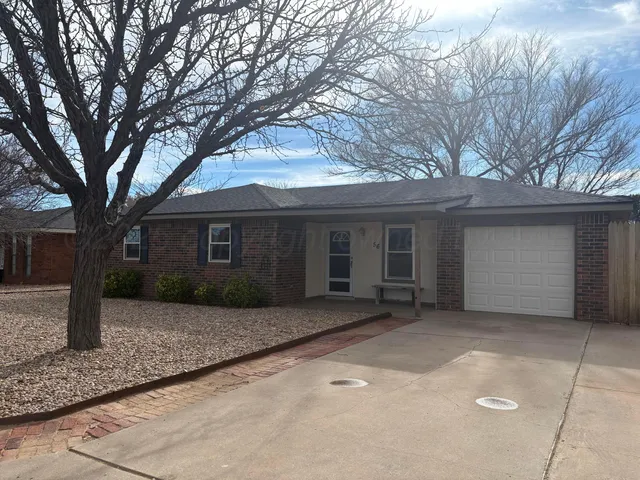 a front view of a house with yard