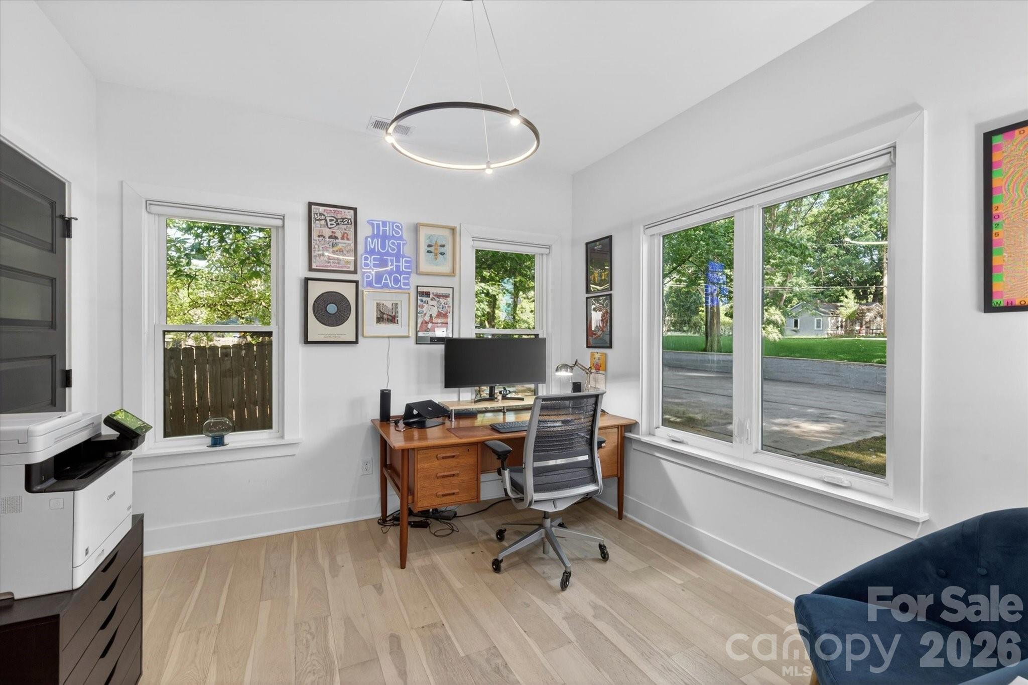 1608 Chippendale Road Charlotte, NC 28205 - Photo 13 of 46 a workspace with furniture and a window