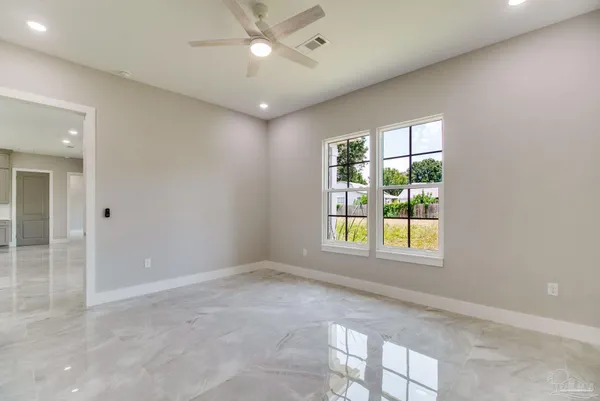a view of an empty room with a window