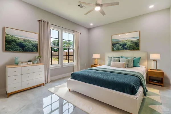 a bedroom with a bed and a window