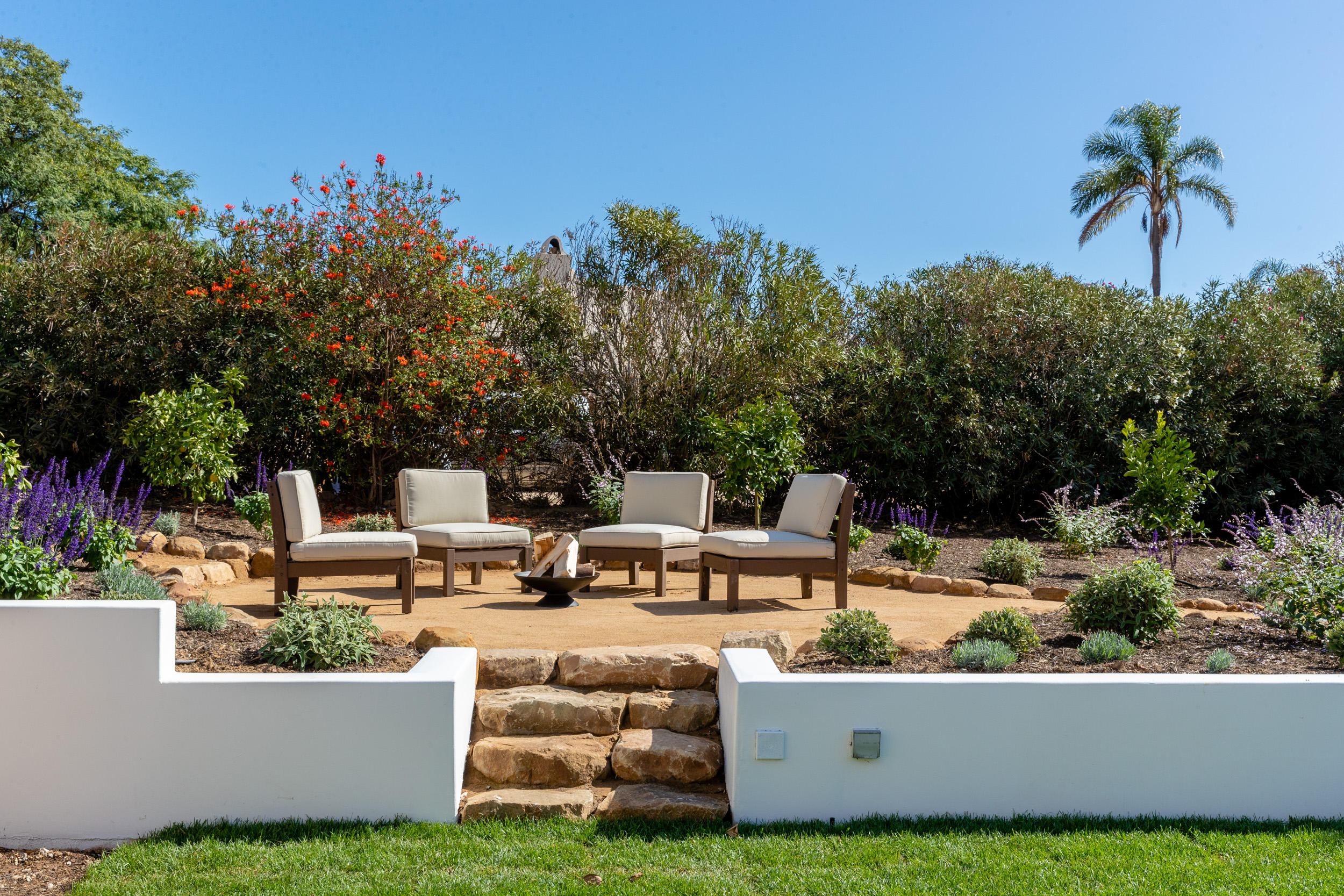 4671 La Espada Drive Santa Barbara, CA 93111 - Photo 33 of 37 a view of a house with patio and a garden
